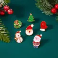 Detailed view of six festive Christmas enamel pins featuring Santa, a snowman and tree. - 6 Pieces/Pack / Christmas Element Collection 1 (BC26Y0009-1)