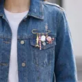 Close-up of marine theme safety pin brooch with pearl and crab charms on denim jacket - Red Crab Fish Style (26Y0005)
