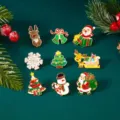 Macro view of cartoon Christmas enamel brooches featuring Santa, Snowman, and Trees - 9 Pieces/Pack / Christmas Element Collection 3 (BC26Y0009-3)
