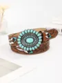 Detailed view of vintage bohemian belt featuring turquoise stones and floral leather embossing - 100cm / Amber
