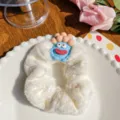 Cute white plush scrunchie hair tie featuring a blue big-eyed monster charm for girls - Cute Baby White