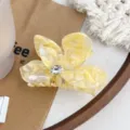 Elegant yellow acetate flower hair claw clip with a sparkly rhinestone center piece - 9.5cm / Floral Yellow