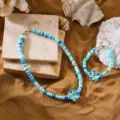 Colorful polymer clay ocean-themed jewelry set with blue plumeria flower charms - Necklace and Bracelet Set / Blue Set