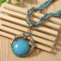 Exquisite detail view of Bohemian ethnic necklace with turquoise pendant and woven cord - Dark Blue