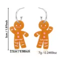Orecchini festivi a omino di pan di zenzero arancioni con altezza 5cm e peso di 7g - Omino Pan di Zenzero che Saluta