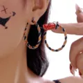 Orange and black glitter twisted hoop earrings for Halloween or festive parties - Orange & Black Glitter Spiral Hoop (ER25Y0151)