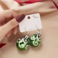 Festive green Christmas ball earrings with white swirl pattern on jewelry display card - Green Spiral Stripe Christmas Ball Earrings (4#ER21Y0619-2)