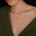Gold stainless steel Y-shaped necklace with heart charms worn by model - Gold Multi-Heart Y-Necklace(NC26Y0264)