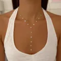 Elegant gold stainless steel Y-shaped necklace with sparkling circular cubic zirconia stones. - Gold Beaded Round Rhinestone Y-Necklace(NC26Y0268)