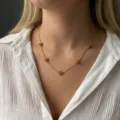 Elegant gold stainless steel necklace with delicate rose flower charms on a model - Gold Five-Rose Flower Necklace(NC26Y0272-1)