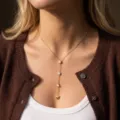 Elegant gold stainless steel Y-shaped necklace with heart and zircon pendants on model - Gold Heart Geometric Rhinestone Y-Necklace(NC26Y0279)
