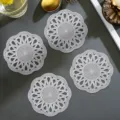 Set of four round hollow flower PVC coasters, elegant heat-insulation table mats for coffee and tea. - 10cm / Silver