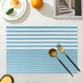 Blue and white striped PVC placemat, waterproof and heat resistant dining table mat for kitchen. - Light Blue Fine Striped