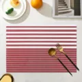 Red and white striped PVC placemat, heat resistant and waterproof table mat for dining room. - Red Fine Striped