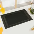 Black PVC woven placemat, heat-resistant table mat, modern dining room decor, stylish table protector. - Black Brown