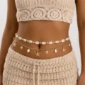 Detail view of a bohemian layered belly chain featuring cowrie shells and gold starfish charms. - Shell Pearl Starfish Style (BJ26Y0142)