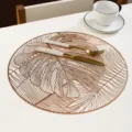 Round PVC placemat with gold stamped monstera leaf pattern, elegant dining table decor. - Diameter 38cm / Rose Gold