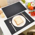Black PVC woven placemat heat resistant waterproof table mat for modern dining room setup - Black Basketweave