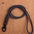 Detail shot of black woven lanyard with metal hook, textured pattern design for daily use. - Black and White Plaid