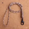 Close-up detail view of handmade woven lanyard phone strap with durable metal clasp. - Desert Camouflage