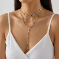 Close-up of elegant multilayer gold necklace with vibrant colorful stones and cross pendant - 多层彩色水钻款(DZ26Y0749)