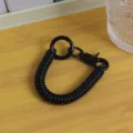 Portachiavi a molla a spirale nera cordino per telefono retrattile cinturino zaino anti-smarrimento. - Nuova corda a molla colorata nera