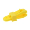 Close-up detail of durable yellow plastic tent clamp for secure outdoor tarp and canopy setup. - Yellow