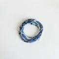 Detailed macro view of Bohemian multi-layer blue and black seed bead waist chain - Multi-layer Beaded Style (Y0323-3) / Dark and Light Blue Color Block