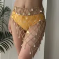 Detail view of gold mesh body chain with shell and pearl charms on yellow bikini. - Diamond Mesh Shell Style (BJ26Y0143)