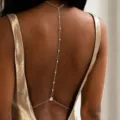 Elegant silver back body chain featuring delicate pearls shown on a metallic dress - 银色细链圆珠水滴型水钻度假背链(BJ26Y0121-1)