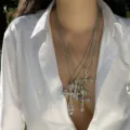 Detailed view of layered hip-hop cross necklaces with pearls and colored gemstones - 银色多层人造珍珠彩钻雕花十字架款(NC25Y1062-2)
