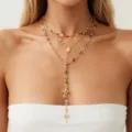 Close-up of elegant layered gold necklace with colorful rhinestones and cross pendants - 金色三层彩色水钻圣母像十字架款(NC25Y1177金色)