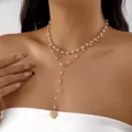Elegant layered gold necklace with white pearls and a vintage heart pendant detail - 金色双层人造珍珠复古心形款(NC25Y1179)