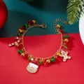 Close-up of a festive Christmas charm bracelet with Santa Claus and gingerbread man charms - #1 Bracelet