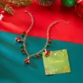 Detailed view of a Christmas necklace featuring festive red and green bell charms and snowflakes - Silver Bell Style (NC25Y0768-3)