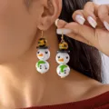 Boucles d'oreilles bonhomme de neige en bois avec détail écharpe verte festive - Bonhomme de Neige Carreaux Jaunes