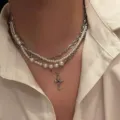 Elegant layered cross pendant necklace featuring silver chains and white pearls - 银色三层珍珠款(NC25Y1063)
