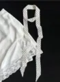 Detailed view of women polka dot silk narrow scarf, elegant white lace trim and black dot ribbon. - Small Polka Dot White