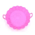 Pink silicone air fryer pot liner detail view featuring convenient handles and bottom ribs. - Pink