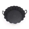 Black silicone air fryer pot detail showing fluted edge and heat-resistant handles. - Black