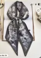 Detail view of a chic black and white landscape print twilly scarf, perfect for bags or neck wear. - Style 5