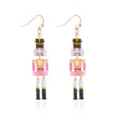 Festive Christmas nutcracker soldier dangle earrings crafted from vibrant pink acrylic - Pink Nutcracker