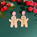 Cute Christmas gingerbread man acrylic dangle earrings with pink studs on green background. - Gingerbread Man Style (ER22Y1669-1)