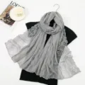 Grey cotton linen scarf detail showing delicate lace embroidery and soft pleated texture design. - 175cm / Gray