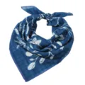 Detail shot of the blue cotton linen square scarf featuring white botanical prints and patterns. - 25 Blue Floral Sprigs