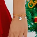 Christmas charm bracelet featuring gold links with snowman and star charms for women - White Snowman Bracelet