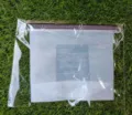 Silicone food storage bag detail showing clear measurement scales and sealing slider mechanism. - Food Storage Bag 2500ml / White