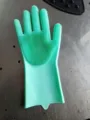 Siliconen afwashandschoen detail met dichte borstels en flexibel groen materiaal. - Groen