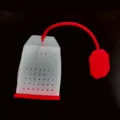 Silicone tea infuser creative tea bag shape with red string and filter holes for loose leaf tea. - Red