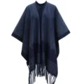 Close-up detail of a thickened navy and blue houndstooth knitted poncho with elegant tassels - 110*150cm / Blue